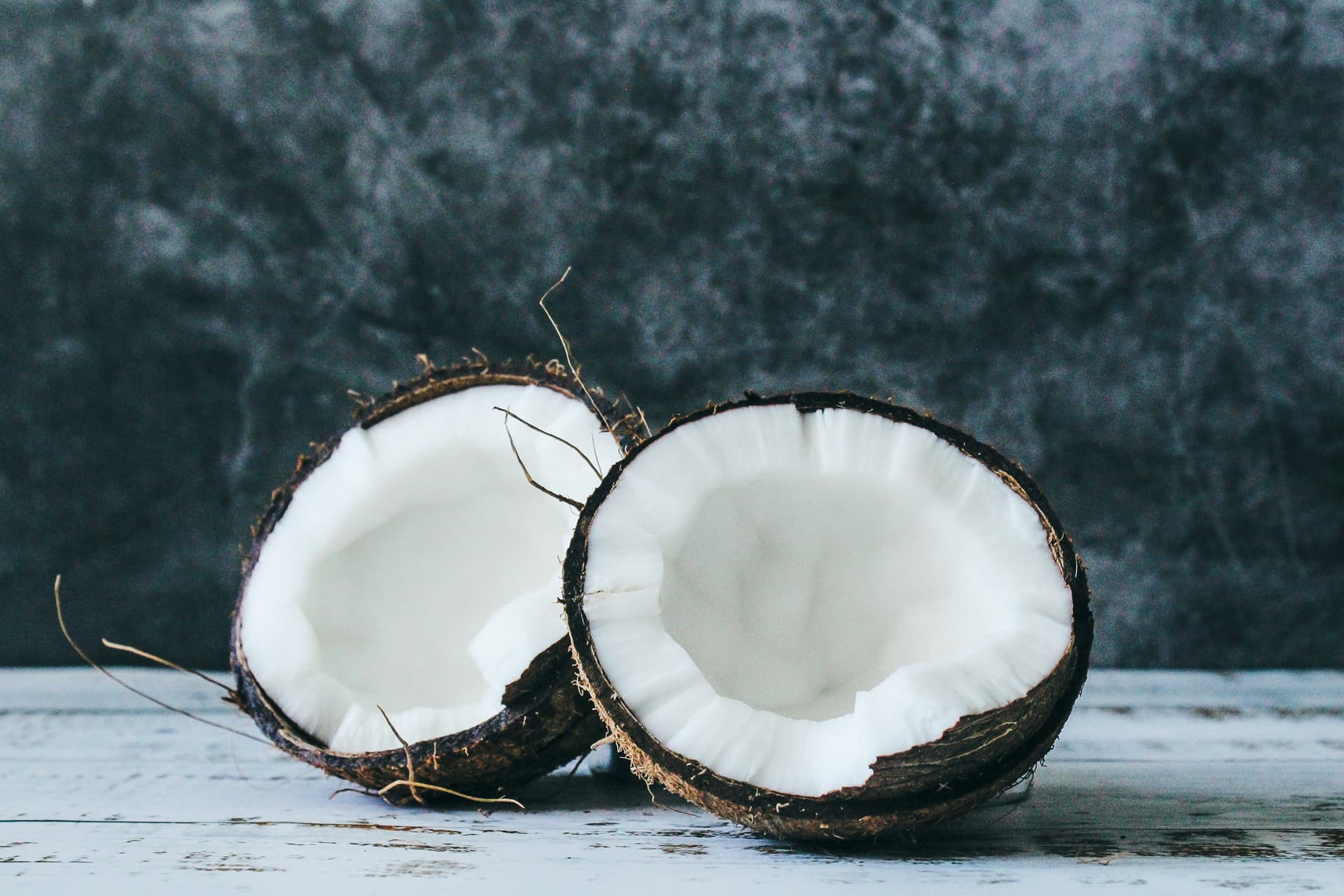 Fresh coconut halves showing white coconut meat