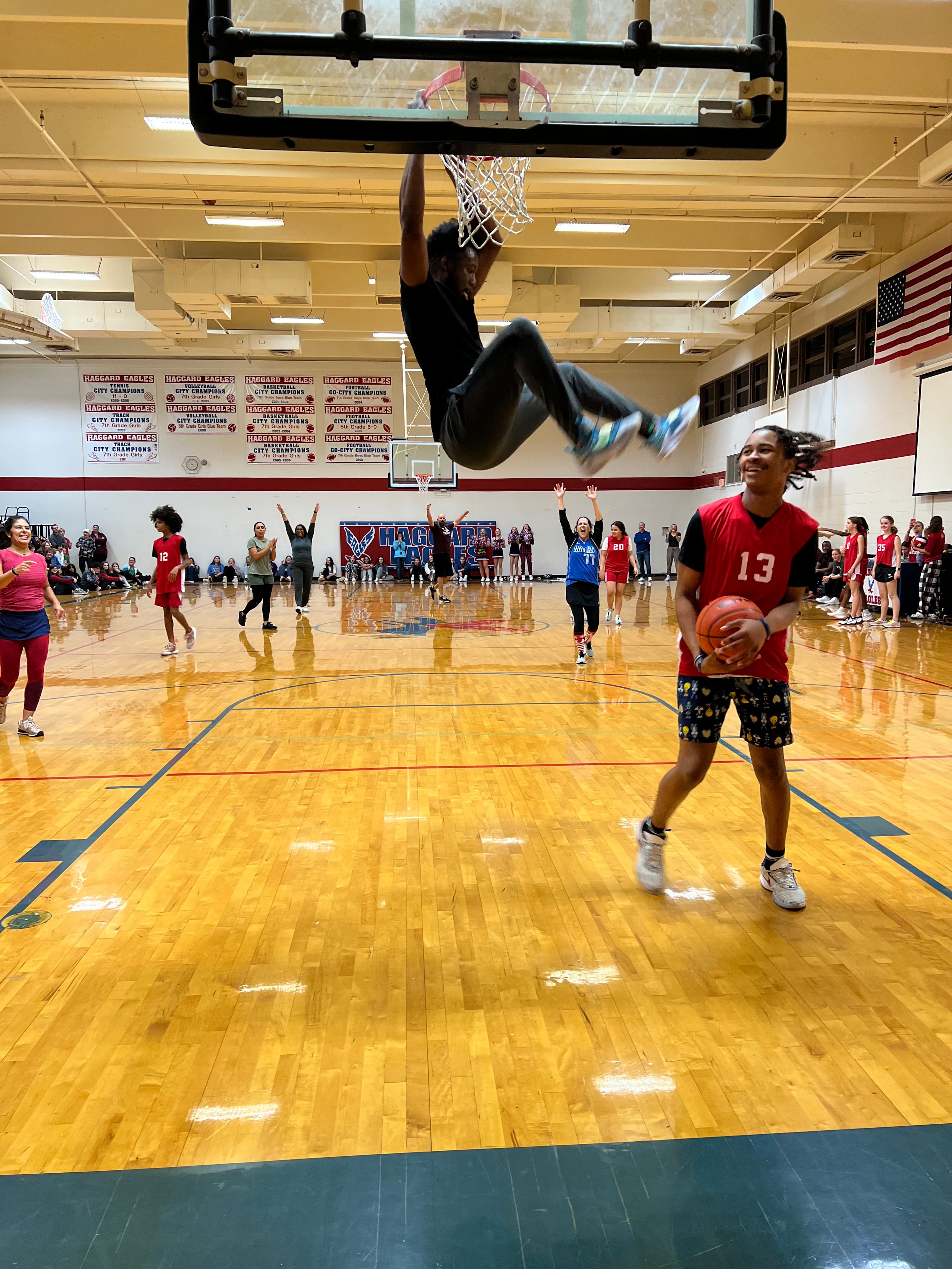 Basketball player executing a dunk during training